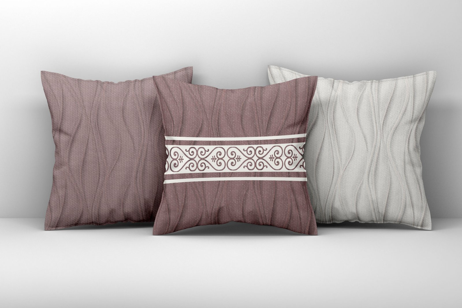 Mockup of three large white pillows